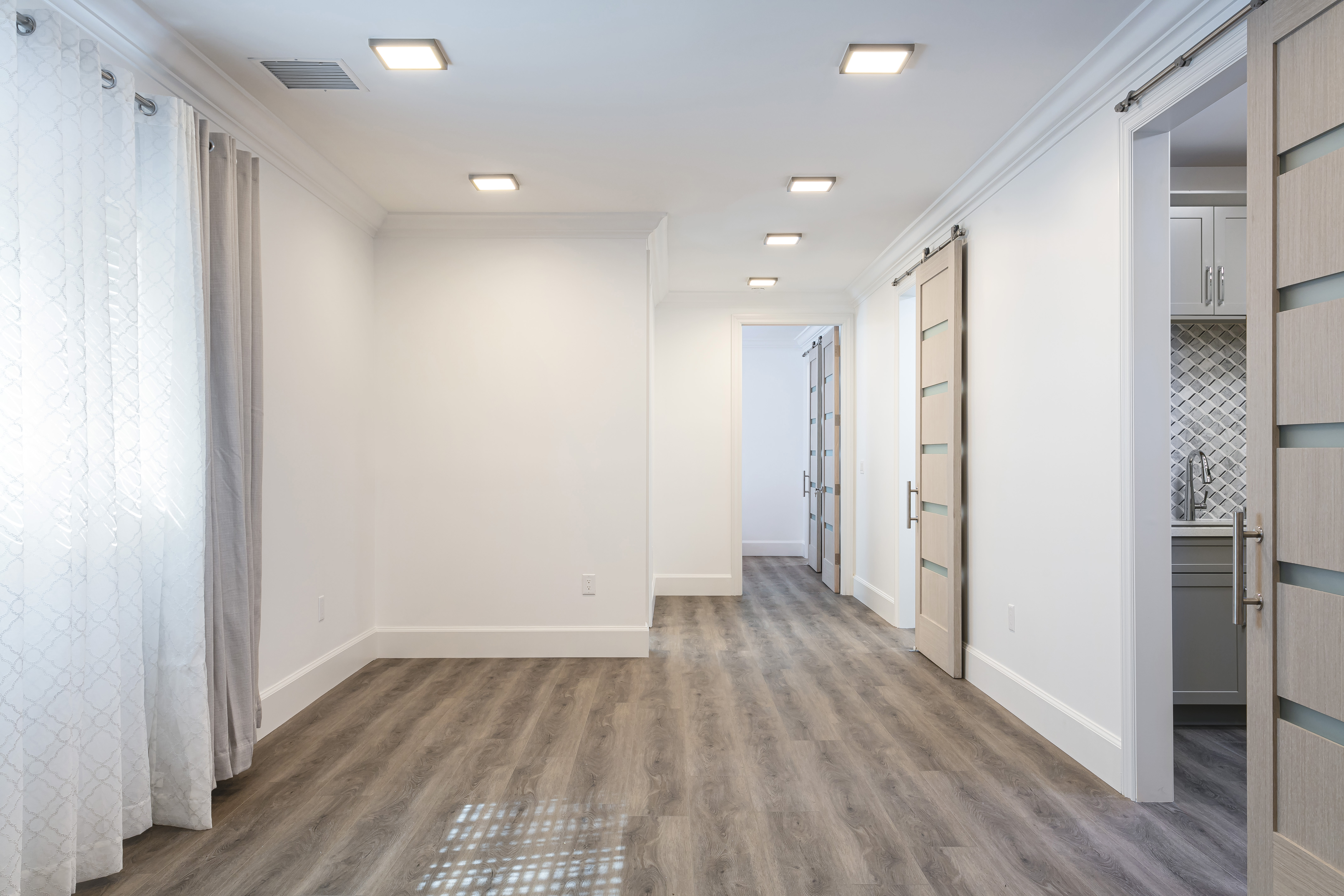 ADU main living area with hardwood floors and recessed lighting