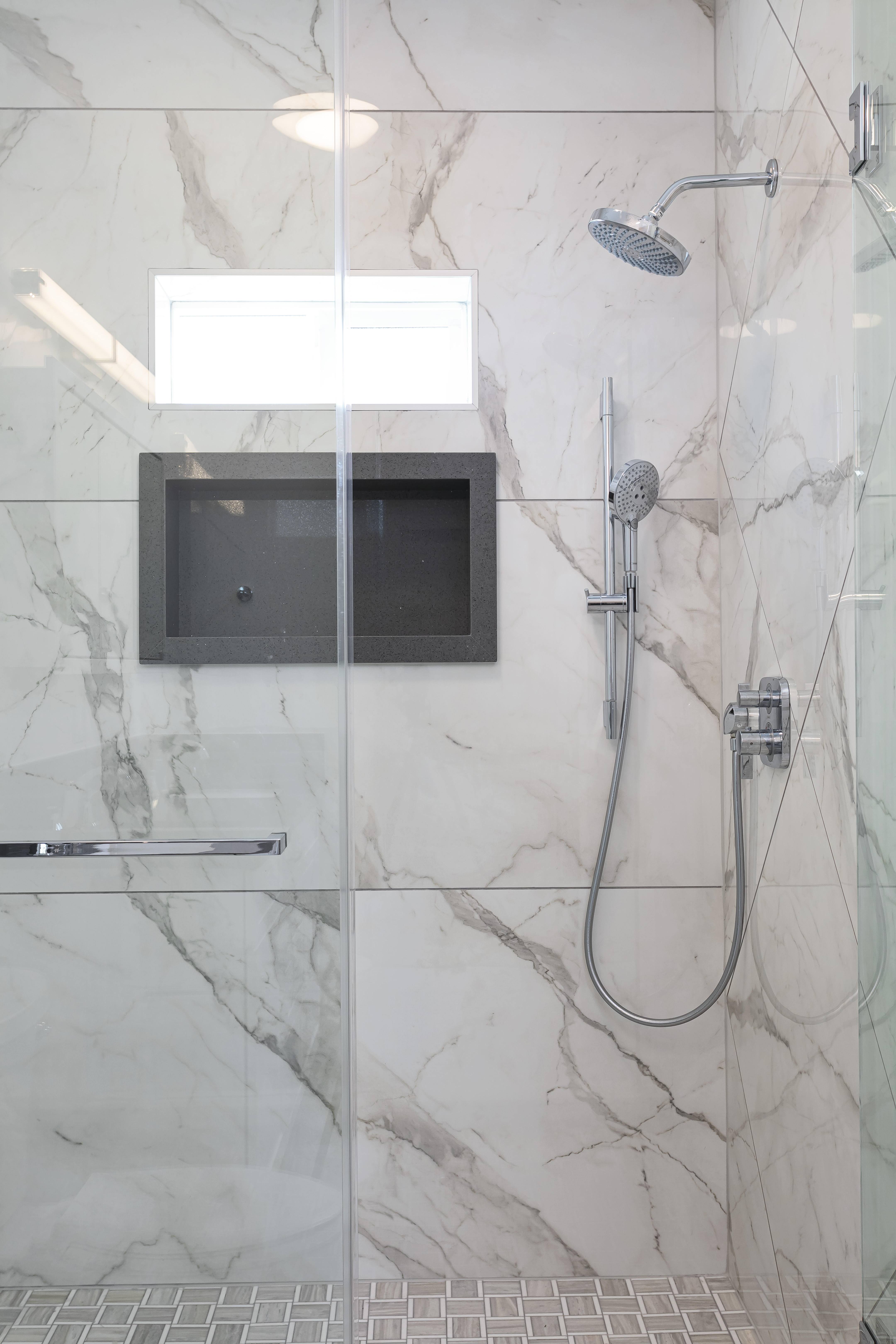 ADU marble shower with rain head — luxury finish